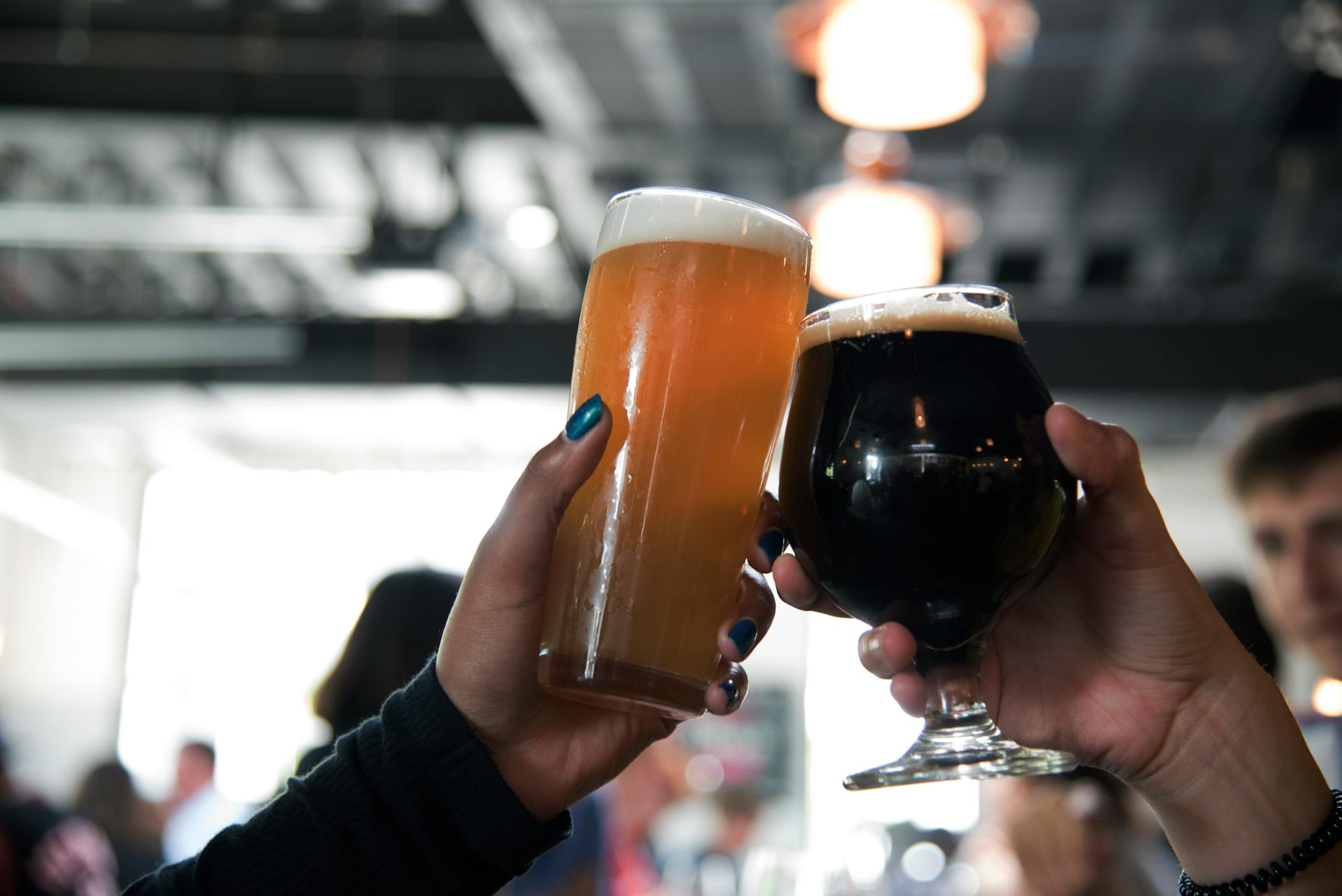 Friends raising pints together